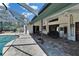 Screened-in pool with brick patio in the backyard at 1801 Sagebrush Rd, Plant City, FL 33566