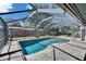 Screened-in pool with brick patio in the backyard at 1801 Sagebrush Rd, Plant City, FL 33566