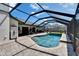 Enjoy this sparkling pool with screened enclosure and brick paver deck for outdoor fun at 1801 Sagebrush Rd, Plant City, FL 33566