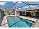 Beautiful screened-in pool with patio and landscaped backyard at 1801 Sagebrush Rd, Plant City, FL 33566