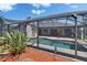 Picture of a backyard pool, screened in, with patio and grill area at 1801 Sagebrush Rd, Plant City, FL 33566