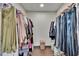 Walk-in closet with built-in clothes rods and wood look floors at 1801 Sagebrush Rd, Plant City, FL 33566