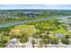 Aerial view of the property highlighting its proximity to the river, baseball fields, tennis courts and local parks at 1809 Elmwood Dr, Oldsmar, FL 34677