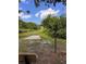 A concrete tee pad and a course marker on a disc golf course at 1809 Elmwood Dr, Oldsmar, FL 34677