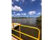 This image shows a personal dock with water and mangroves with beautiful skies at 1809 Elmwood Dr, Oldsmar, FL 34677