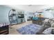 Relaxing living room with soft blue walls, comfortable seating, and stylish decor at 1809 Elmwood Dr, Oldsmar, FL 34677