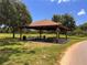Covered picnic pavilion with picnic tables and a grill for outdoor enjoyment at 1809 Elmwood Dr, Oldsmar, FL 34677