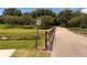 Scenic walking path with a wood bridge on the disc golf course at 1809 Elmwood Dr, Oldsmar, FL 34677