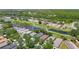 Aerial shot showcasing homes bordering a well-manicured golf course with ponds and mature trees creating a peaceful setting at 18107 Canal Pointe St, Tampa, FL 33647