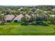Aerial view of a home situated on a golf course, surrounded by lush trees and well-maintained landscaping at 18107 Canal Pointe St, Tampa, FL 33647