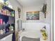 Bathroom with a soaking tub, decorative flowers, shelving and decor at 18107 Canal Pointe St, Tampa, FL 33647