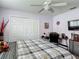 Cozy bedroom features neutral walls, double closets, and a ceiling fan at 18107 Canal Pointe St, Tampa, FL 33647