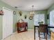 Charming dining area with tile floors, elegant chandelier, and decorative wall features at 18107 Canal Pointe St, Tampa, FL 33647