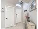 Entryway with tile floor, high ceiling, decorative chandelier, wall decor and coat hooks at 18107 Canal Pointe St, Tampa, FL 33647
