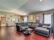 Spacious living room with wood floors, open layout, and view to the dining area at 18107 Canal Pointe St, Tampa, FL 33647