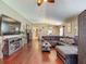 Spacious living room with wood floors, open layout, and view to the dining area at 18107 Canal Pointe St, Tampa, FL 33647