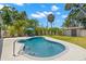 Inviting freeform pool surrounded by lush tropical landscaping creating a private outdoor oasis at 1827 Oregon Ne Ave, St Petersburg, FL 33703