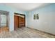 Bedroom features a doorway, closet, and natural light streaming through a window at 1827 Oregon Ne Ave, St Petersburg, FL 33703