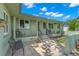 Welcoming covered front porch with seating and a tiled entryway, offering a cozy outdoor space at 1827 Oregon Ne Ave, St Petersburg, FL 33703