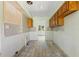 Kitchen featuring classic wood cabinets, subway tile backsplash, and potential for modern upgrades at 1827 Oregon Ne Ave, St Petersburg, FL 33703