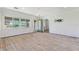 Bright and airy living room awaiting personalization, featuring large windows and hardwood floors at 1827 Oregon Ne Ave, St Petersburg, FL 33703