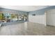 Living room features a sliding glass doors that look out to the patio and backyard at 1827 Oregon Ne Ave, St Petersburg, FL 33703