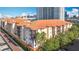 Aerial view of condo buildings with red tile roofs in a vibrant urban neighborhood at 200 4Th S Ave # 229, St Petersburg, FL 33701