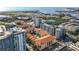 An aerial view of residential neighborhood near the ocean, with lush green spaces and city views at 200 4Th S Ave # 229, St Petersburg, FL 33701