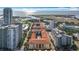 Aerial view of condo buildings, airport, and waterfront in a sunny, coastal community at 200 4Th S Ave # 229, St Petersburg, FL 33701