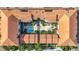 Aerial view showcasing community pool, hot tub, fountain, seating, landscaping, and buildings at 200 4Th S Ave # 229, St Petersburg, FL 33701