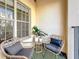 Relax on this cozy condo balcony featuring stylish chairs, perfect for enjoying outdoor moments at 200 4Th S Ave # 229, St Petersburg, FL 33701