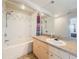 Bright bathroom featuring vanity with a large mirror, and a shower-tub combination with tiled walls at 200 4Th S Ave # 229, St Petersburg, FL 33701