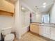 Bathroom with a full tub and shower combination and a spacious light wood vanity at 200 4Th S Ave # 229, St Petersburg, FL 33701
