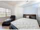 Bright bedroom with hardwood floors featuring a plush mattress and a comfortable chaise lounge at 200 4Th S Ave # 229, St Petersburg, FL 33701