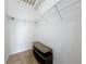 Walk-in closet with wire shelving and an additional storage bench, offering ample space for organization at 200 4Th S Ave # 229, St Petersburg, FL 33701