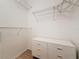 Walk-in closet with wire shelving and a dresser with gold hardware at 200 4Th S Ave # 229, St Petersburg, FL 33701
