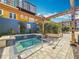Community hot tub with trellis, tiled trim, and lush landscape at 200 4Th S Ave # 229, St Petersburg, FL 33701
