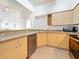 Kitchen view features maple cabinets, stainless steel dishwasher and microwave at 200 4Th S Ave # 229, St Petersburg, FL 33701