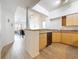 Bright and open kitchen featuring wood cabinets and stainless steel appliances at 200 4Th S Ave # 229, St Petersburg, FL 33701