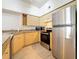 Kitchen view with stainless steel appliances and light wood cabinets at 200 4Th S Ave # 229, St Petersburg, FL 33701