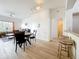 Open concept living room and dining area with wood floors and bright natural lighting at 200 4Th S Ave # 229, St Petersburg, FL 33701