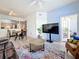 Open floor plan shows the living room, dining area, and kitchen, offering seamless transitions and natural light at 200 4Th S Ave # 229, St Petersburg, FL 33701