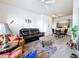 Living room has leather seating, an area rug, modern decor, and an open floor plan at 200 4Th S Ave # 229, St Petersburg, FL 33701