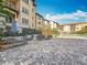 Outdoor lounge area with umbrella-covered seating and beautifully landscaped courtyard at 200 4Th S Ave # 229, St Petersburg, FL 33701