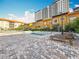 Resort-style pool area featuring lounge chairs, and a fountain, surrounded by lush landscaping at 200 4Th S Ave # 229, St Petersburg, FL 33701