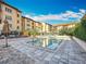 Resort style pool and patio area with lounge seating and well-maintained landscaping at 200 4Th S Ave # 229, St Petersburg, FL 33701