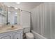 Full bathroom featuring a shower-tub combo with tile surround, a toilet, and vanity at 224 Aspen Cir # 224, Seminole, FL 33777