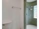 Bathroom featuring a mosaic tiled walk-in shower and modern fixtures at 224 Aspen Cir # 224, Seminole, FL 33777