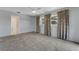 Light-filled bedroom with views of the en-suite bathroom, patterned curtains, and plush carpeting at 224 Aspen Cir # 224, Seminole, FL 33777
