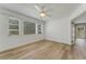 Bright bedroom with natural light and luxury vinyl flooring with multiple windows overlooking community at 224 Aspen Cir # 224, Seminole, FL 33777